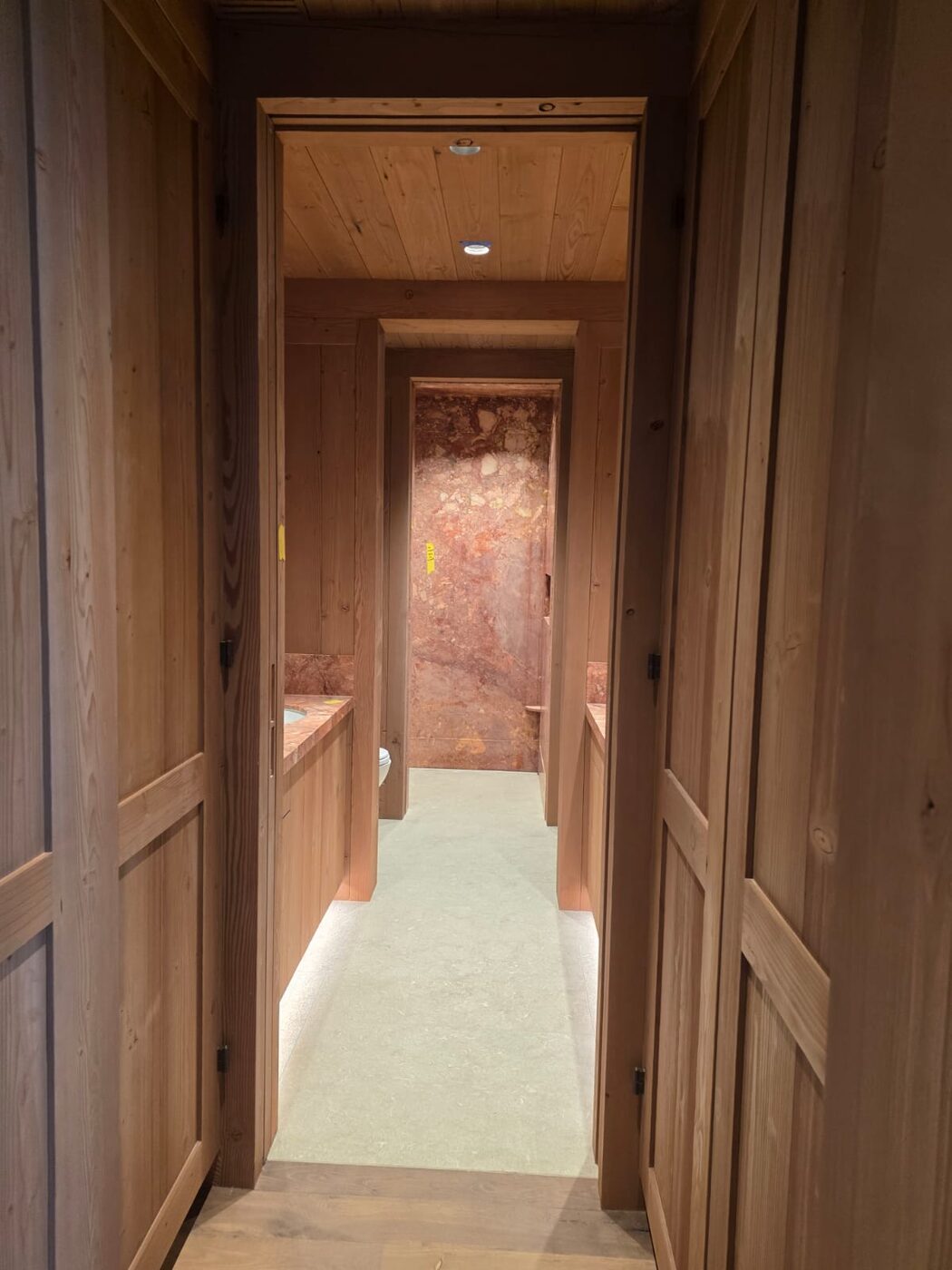 Custom wood paneled hallway and vanity