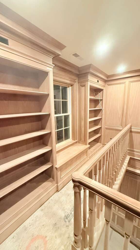 Custom library shelving and window seat